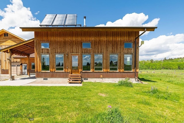 241 Aspen Loop Rd, West Yellowstone, MT 59758 - rear view of house with crawl space, a lawn, and a patio