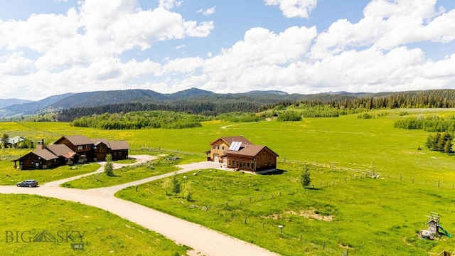 241 Aspen Loop Rd, West Yellowstone, MT 59758 - aerial view of sparsely populated area with a mountainous background and a pastoral area
