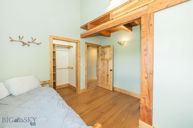 241 Aspen Loop Rd, West Yellowstone, MT 59758 - bedroom with light wood-style floors and a closet