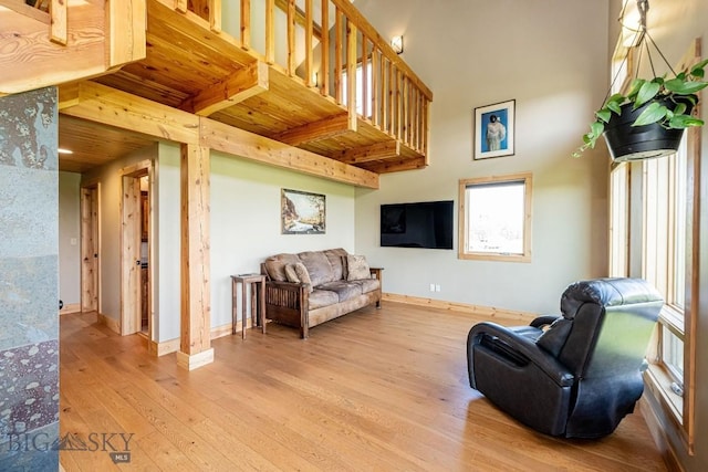 241 Aspen Loop Rd, West Yellowstone, MT 59758 - living room with hardwood / wood-style flooring and a wood ceiling with exposed beams