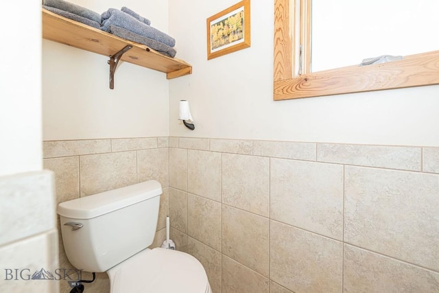 241 Aspen Loop Rd, West Yellowstone, MT 59758 - bathroom featuring toilet and tile walls