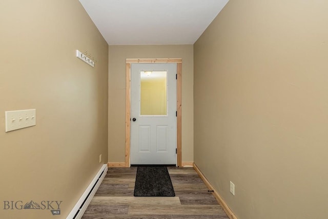 241 Aspen Loop Rd, West Yellowstone, MT 59758 - doorway with wood finished floors and a baseboard heating unit