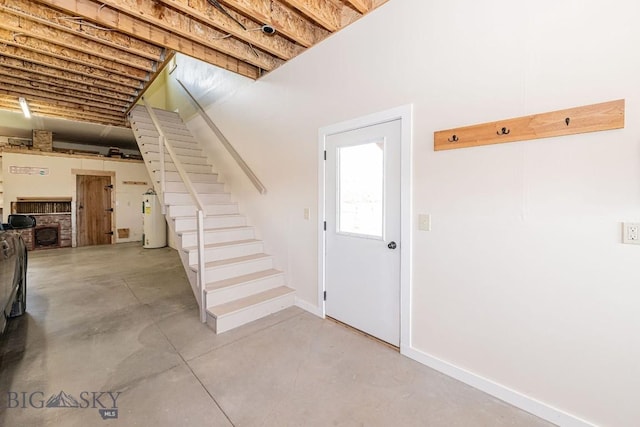 241 Aspen Loop Rd, West Yellowstone, MT 59758 - below grade area featuring stairway and electric water heater