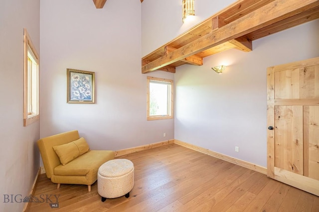 241 Aspen Loop Rd, West Yellowstone, MT 59758 - living area featuring hardwood / wood-style flooring and beamed ceiling