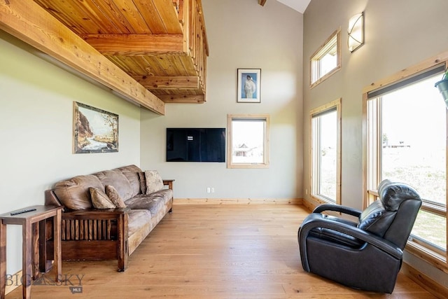 241 Aspen Loop Rd, West Yellowstone, MT 59758 - living room featuring a wood ceiling with exposed beams and light wood-type flooring