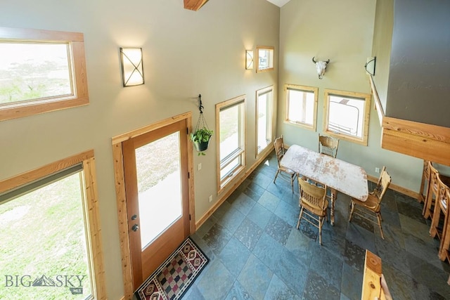 241 Aspen Loop Rd, West Yellowstone, MT 59758 - dining area with a towering ceiling and stone finish floors