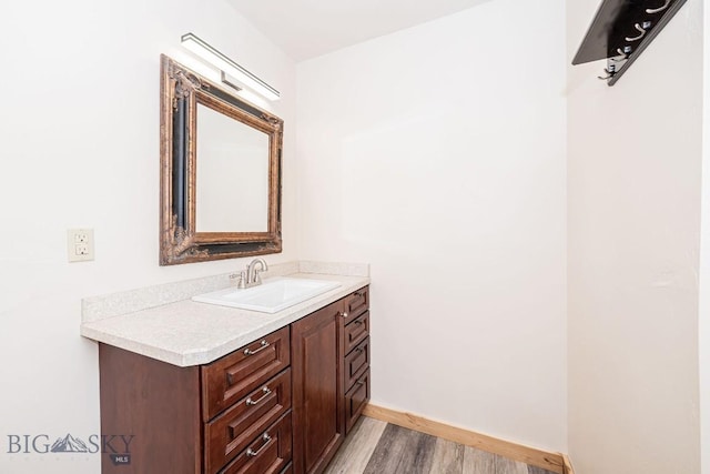241 Aspen Loop Rd, West Yellowstone, MT 59758 - bathroom with wood finished floors and vanity