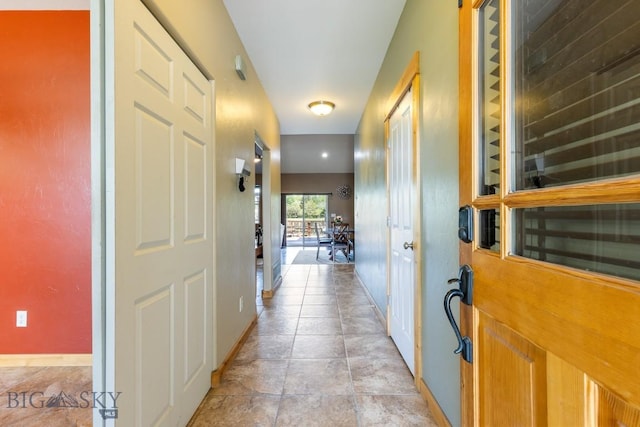 988 Meagher, Bozeman, MT 59718 - hallway featuring baseboards and light stone finish flooring