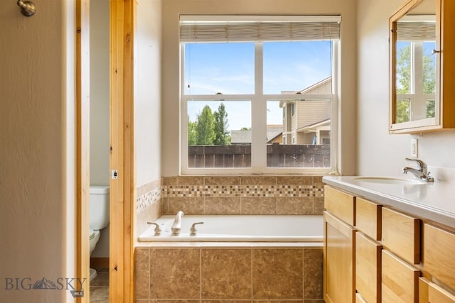 988 Meagher, Bozeman, MT 59718 - full bath featuring tiled tub, plenty of natural light, and vanity