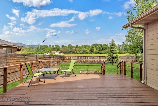 988 Meagher, Bozeman, MT 59718 - wooden terrace with a fenced backyard and a mountain view