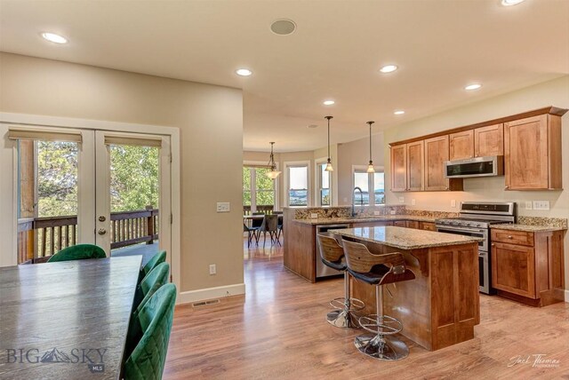 960 Strawberry, Helena, MT 59601 - kitchen featuring stainless steel appliances, french doors, a peninsula, light wood-type flooring, and recessed lighting