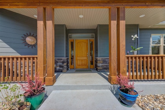 960 Strawberry, Helena, MT 59601 - view of exterior entry with a porch and stone siding