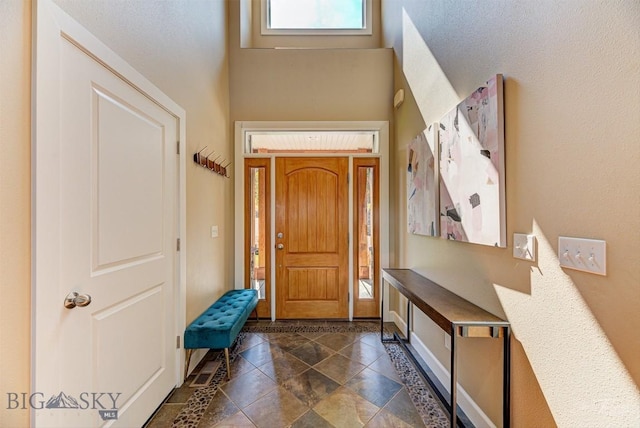 960 Strawberry, Helena, MT 59601 - foyer featuring a towering ceiling and baseboards