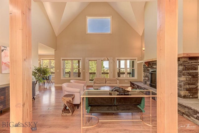 960 Strawberry, Helena, MT 59601 - living area featuring a fireplace, wood finished floors, and high vaulted ceiling
