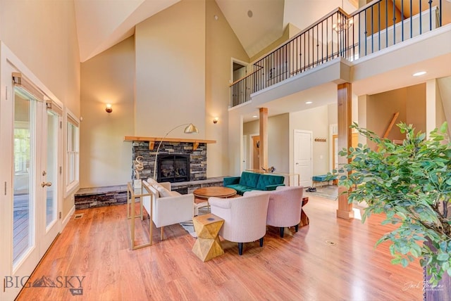 960 Strawberry, Helena, MT 59601 - living room featuring a towering ceiling, wood finished floors, and a fireplace