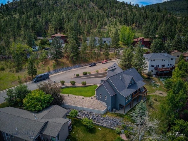 960 Strawberry, Helena, MT 59601 - aerial view of property and surrounding area featuring a heavily wooded area