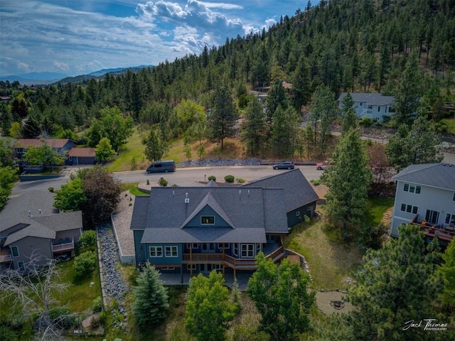 960 Strawberry, Helena, MT 59601 - view of subject property with a forest and a mountain backdrop