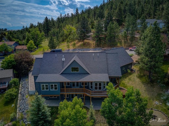 960 Strawberry, Helena, MT 59601 - aerial view of property and surrounding area with a heavily wooded area