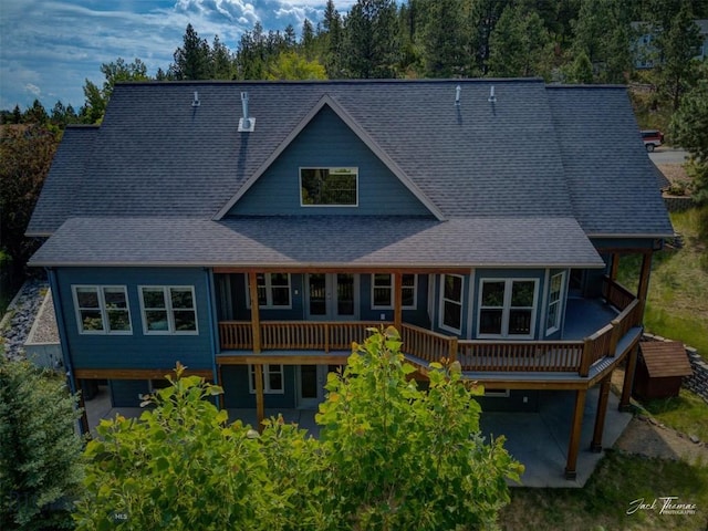 960 Strawberry, Helena, MT 59601 - rear view of property featuring a wooden deck, a patio area, and a shingled roof