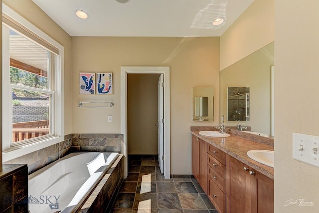 960 Strawberry, Helena, MT 59601 - bathroom with double vanity, a bath, and recessed lighting