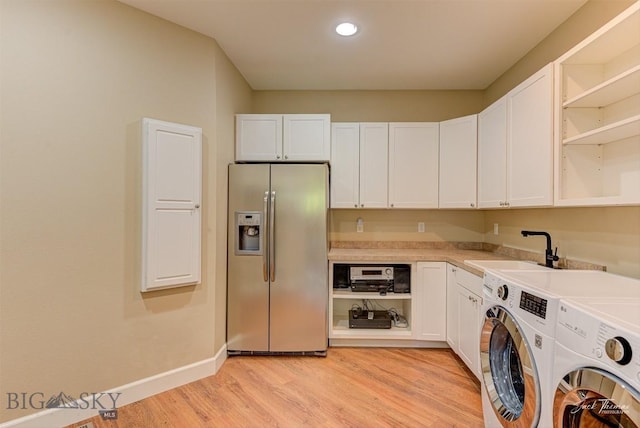 960 Strawberry, Helena, MT 59601 - laundry room featuring washer and dryer, light wood-style floors, recessed lighting, and cabinet space