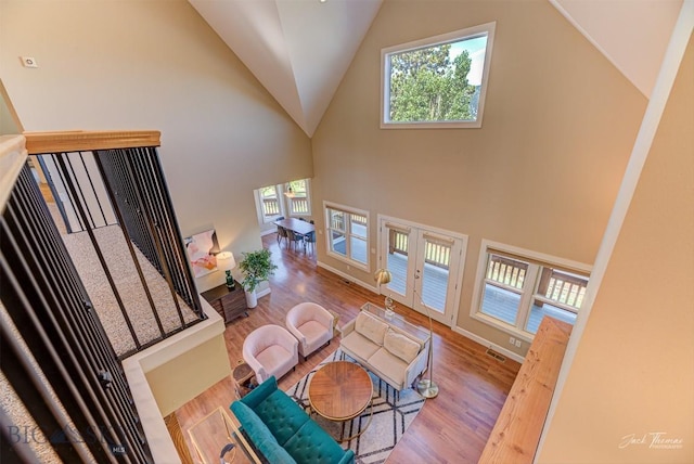 960 Strawberry, Helena, MT 59601 - living area with wood finished floors, plenty of natural light, high vaulted ceiling, and french doors