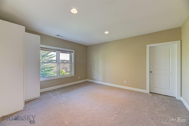 960 Strawberry, Helena, MT 59601 - unfurnished room with light carpet and recessed lighting