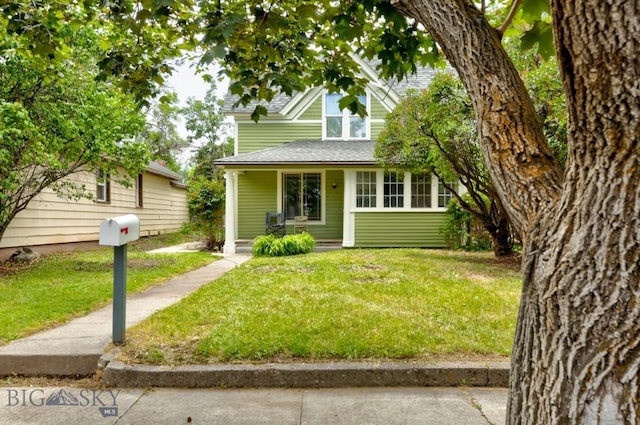 326 S 5th St, Livingston, MT 59047 - view of front facade with a front yard and a shingled roof