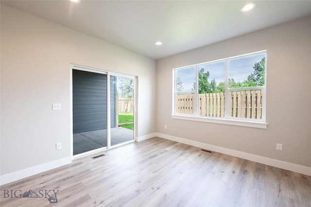 488 Meriwether Ave, Bozeman, MT 59718 - unfurnished bedroom with access to outside, wood finished floors, and recessed lighting