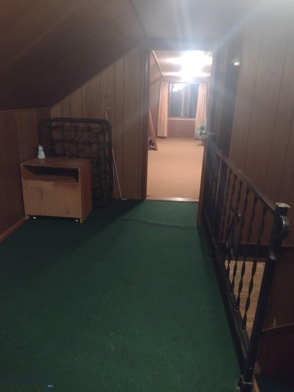 600 C St, Townsend, MT 59644 - corridor featuring lofted ceiling, carpet floors, and wooden walls