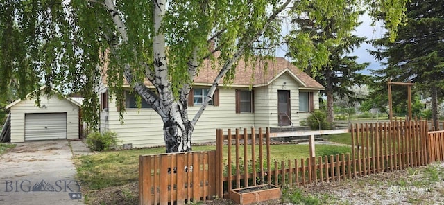 600 C St, Townsend, MT 59644 - view of front of home with an outbuilding, driveway, a garage, and roof with shingles