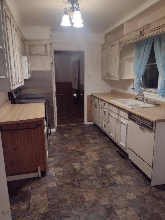 600 C St, Townsend, MT 59644 - kitchen with white appliances, stone finish floors, and wooden counters