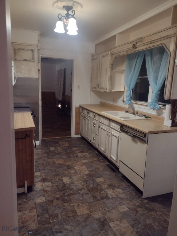 600 C St, Townsend, MT 59644 - kitchen featuring white dishwasher, a chandelier, butcher block counters, and stone finish flooring