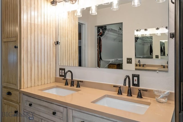 605 E Cameron Brg, Bozeman, MT 59718 - bathroom featuring double vanity and a walk in closet