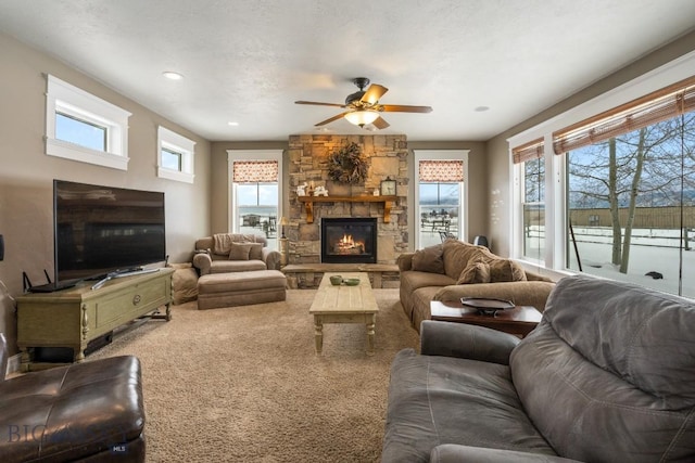 605 E Cameron Brg, Bozeman, MT 59718 - carpeted living area with a ceiling fan, a stone fireplace, and recessed lighting