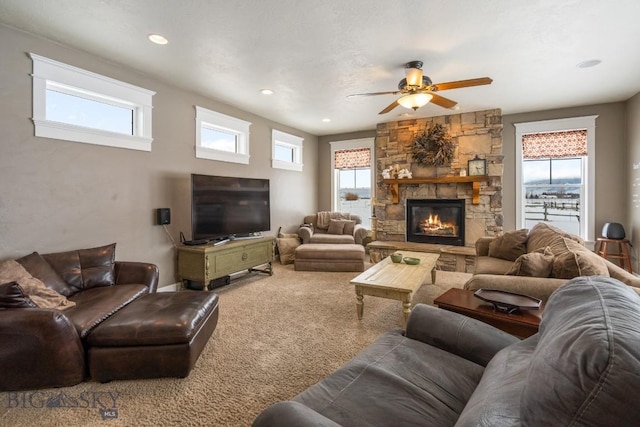 605 E Cameron Brg, Bozeman, MT 59718 - living room with ceiling fan, a stone fireplace, carpet floors, and recessed lighting