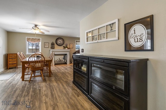605 E Cameron Brg, Bozeman, MT 59718 - dining area with ceiling fan, a fireplace, dark wood-style floors, and recessed lighting