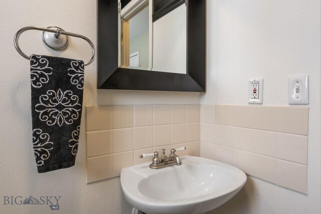 605 E Cameron Brg, Bozeman, MT 59718 - bathroom featuring a sink and decorative backsplash