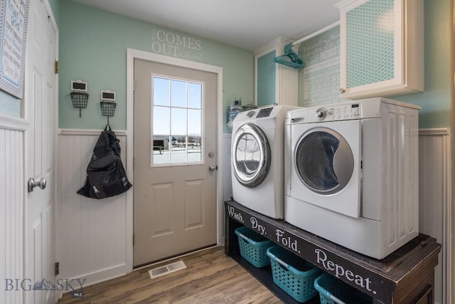 605 E Cameron Brg, Bozeman, MT 59718 - laundry room with separate washer and dryer, wood finished floors, and wainscoting
