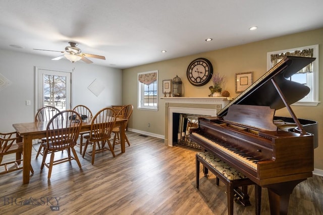 605 E Cameron Brg, Bozeman, MT 59718 - dining room featuring ceiling fan, wood finished floors, recessed lighting, and a glass covered fireplace