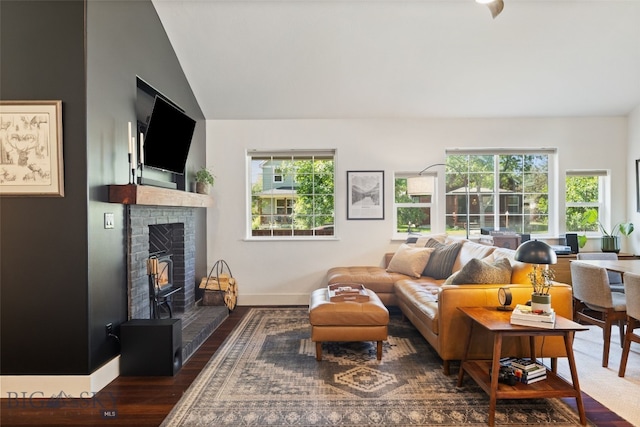 25 W Dooley Ln, Belgrade, MT 59714 - living room featuring wood finished floors, a fireplace, and lofted ceiling