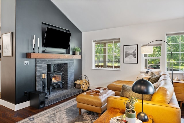 25 W Dooley Ln, Belgrade, MT 59714 - living room featuring wood finished floors, vaulted ceiling, and a wood stove