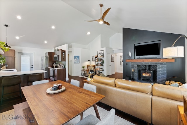 25 W Dooley Ln, Belgrade, MT 59714 - living area with ceiling fan, dark wood-type flooring, high vaulted ceiling, and recessed lighting