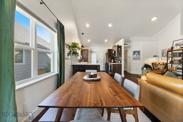 25 W Dooley Ln, Belgrade, MT 59714 - dining room with lofted ceiling, dark wood-style floors, and recessed lighting