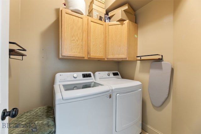 25 W Dooley Ln, Belgrade, MT 59714 - laundry area with washing machine and clothes dryer and cabinet space