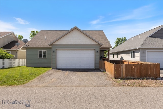 25 W Dooley Ln, Belgrade, MT 59714 - view of front facade featuring driveway, a garage, and a shingled roof