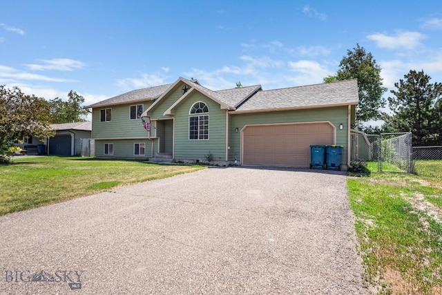 704 Mayfair Dr, Belgrade, MT 59714 - view of front of property with a garage and asphalt driveway