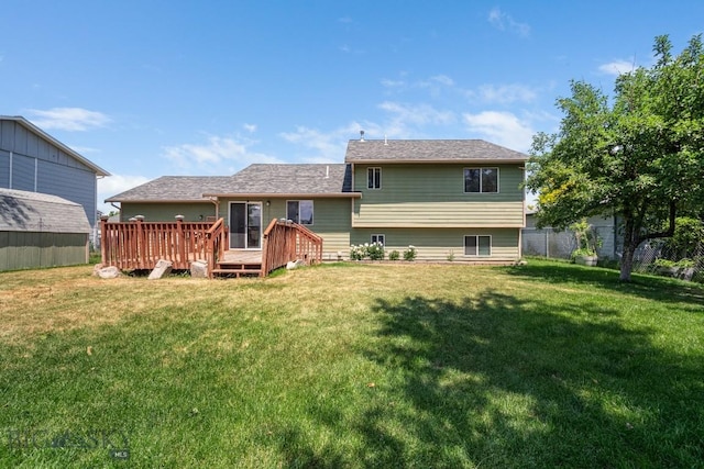 704 Mayfair Dr, Belgrade, MT 59714 - rear view of house with a lawn and a deck