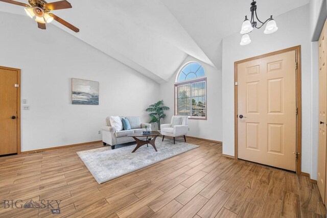 704 Mayfair Dr, Belgrade, MT 59714 - entrance foyer featuring vaulted ceiling, a ceiling fan, light wood-style floors, and a chandelier