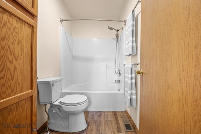 704 Mayfair Dr, Belgrade, MT 59714 - bathroom featuring  shower combination and wood finished floors